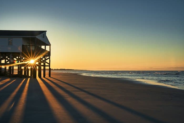 Raised beach house at sunrise